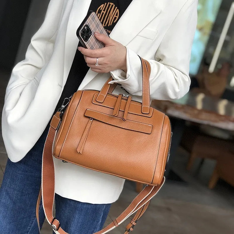 Genuine leather messenger bag with litchi pattern texture in a horizontal square shape.