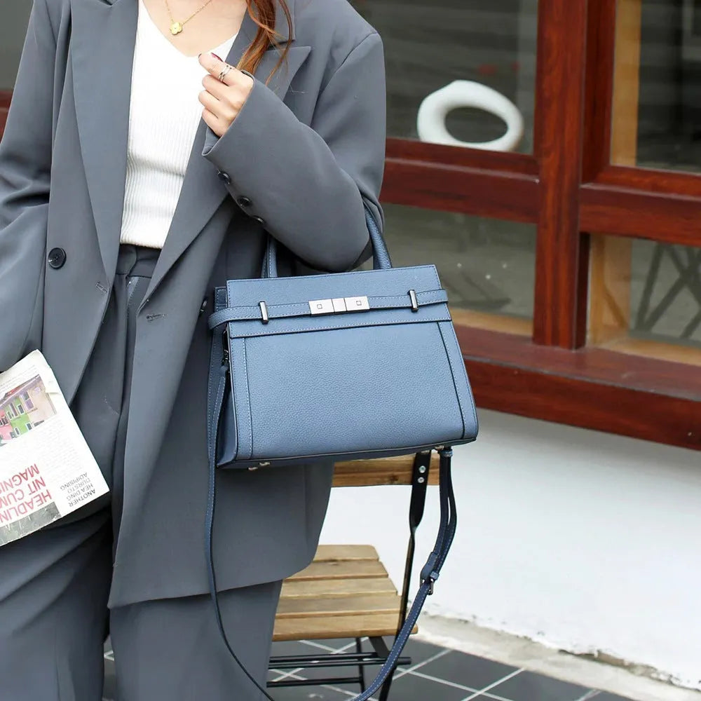 Genuine leather shoulder bag in horizontal square shape with multiple compartments and sandwich pocket design