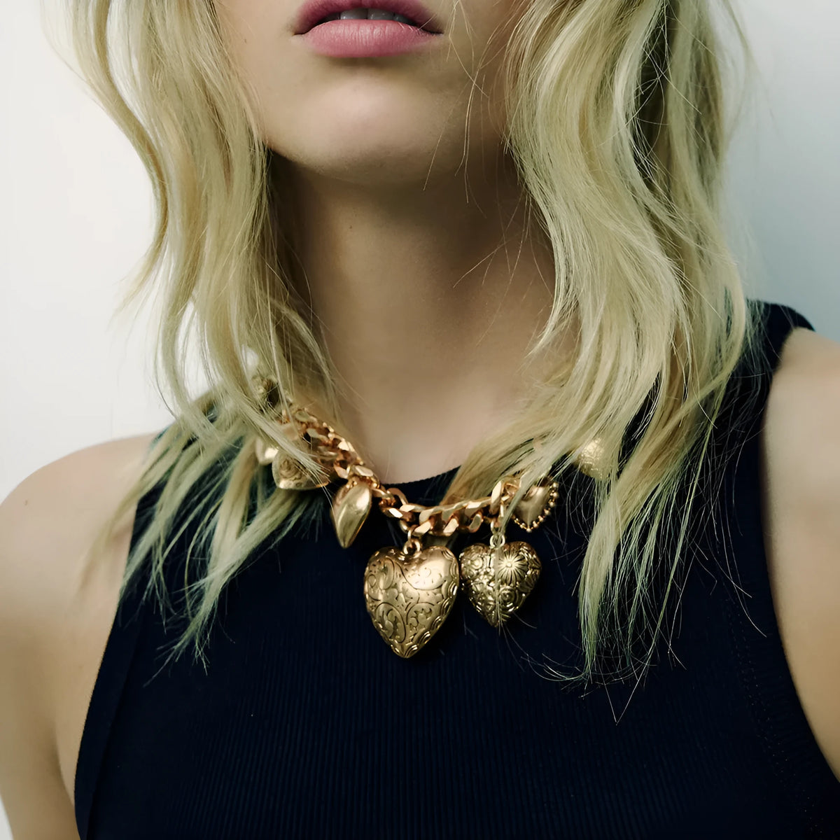 Carved heart pendant necklace on adjustable 41-50cm chain in gold alloy metal