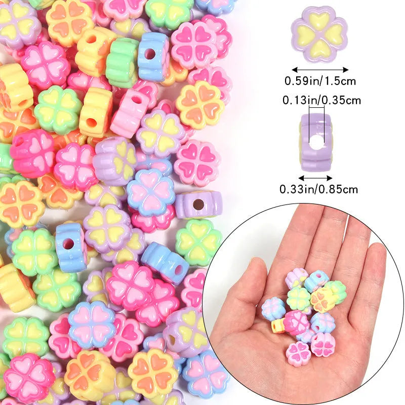 15mm acrylic clover-shaped beads with love pattern in multiple pastel colours including rose red, pink, yellow, green, blue, and purple