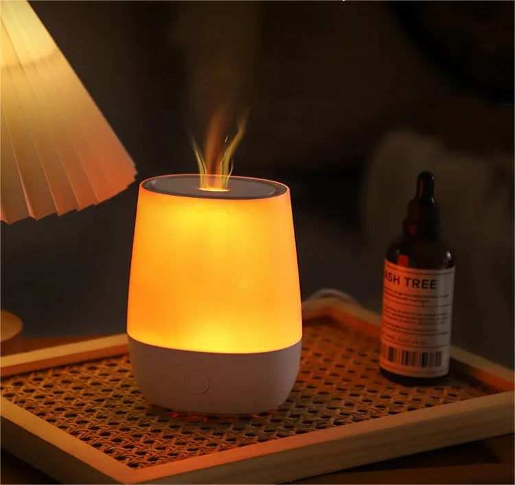 White USB aromatherapy humidifier with simulated flame effect, compact design with water tank