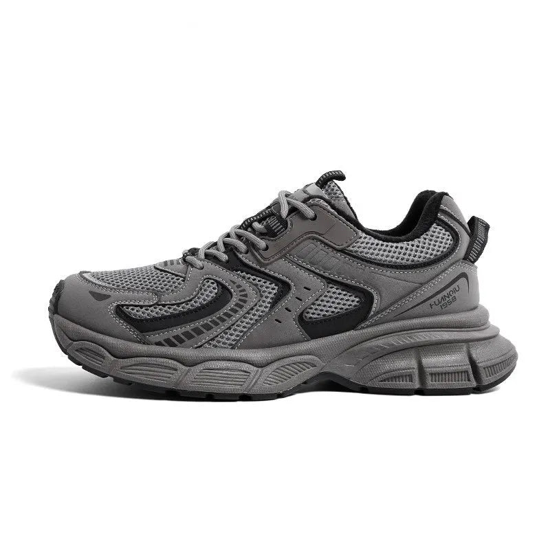 Grey low-top casual dad sneakers with a mid heel, PU mesh upper, and leather stitching on a white background.