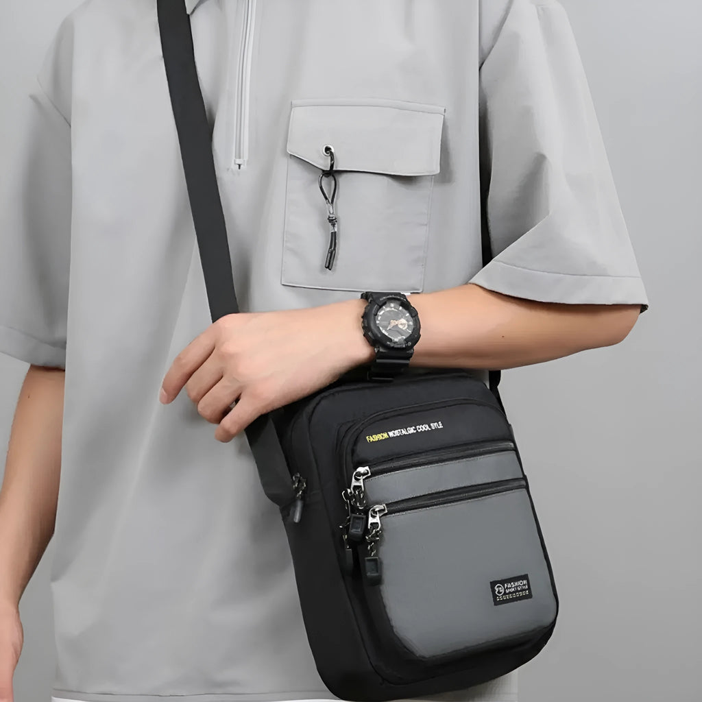 Men's nylon crossbody bag in green colour with multiple compartments and adjustable strap.
