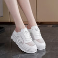 Women's black mesh half slippers with round toe and rubber sole, showing height increasing feature