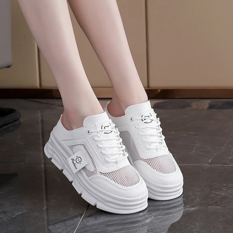 Women's black mesh half slippers with round toe and rubber sole, showing height increasing feature