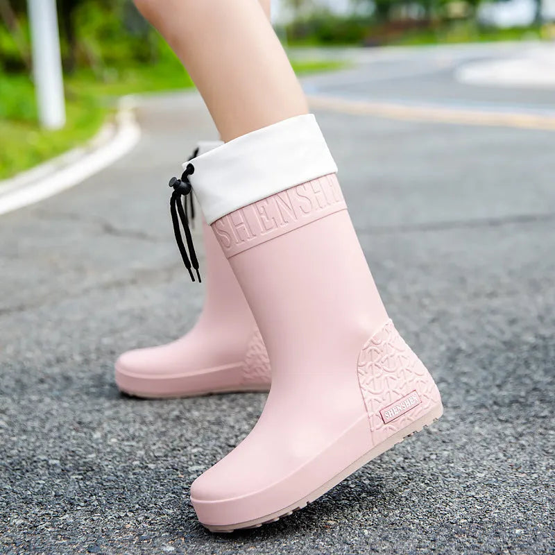 Women's solid colour PVC rain boots with a non-slip sole.