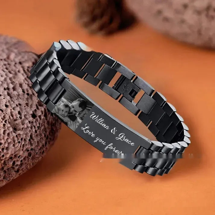 Titanium steel curved heart bracelet with black lettering on wrist