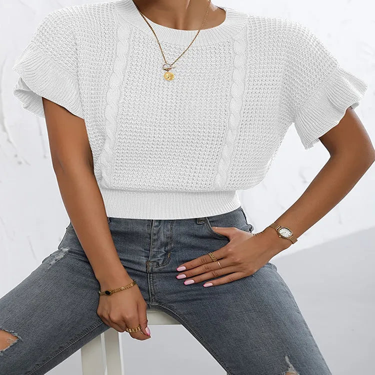 Knitted pullover sweater with ruffled short sleeves and twisted string detail in a loose fit.