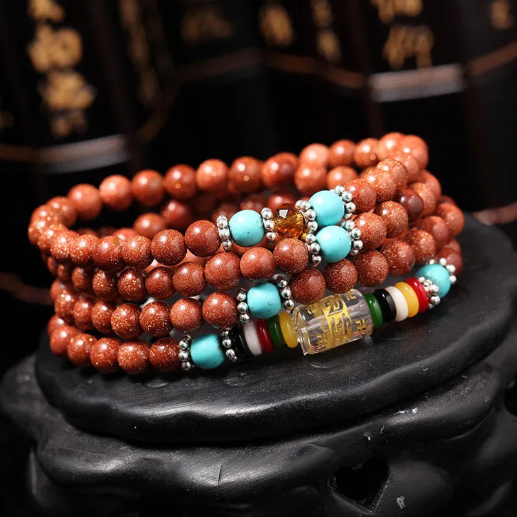 Golden star stone mantra bracelet with 108 sand beads and fu character ornament