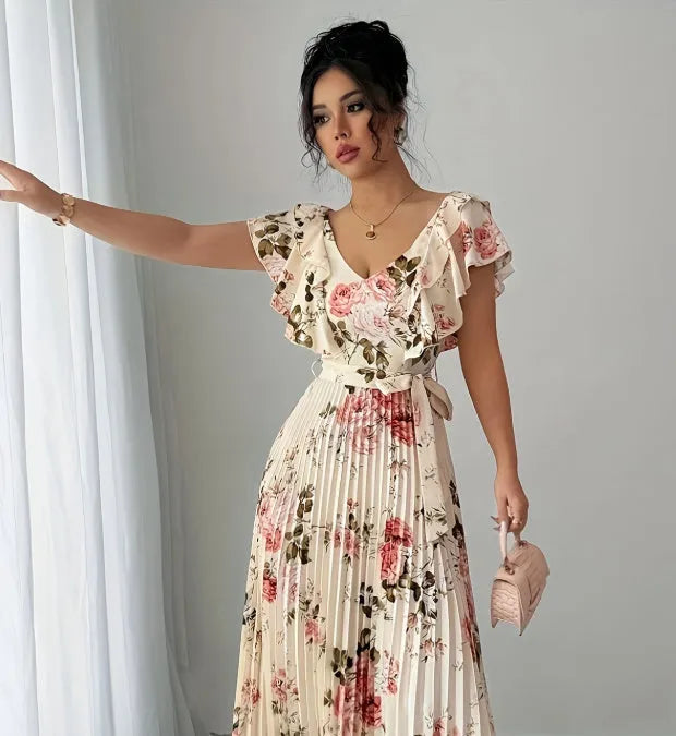 Apricot floral print dress with V-neck, ruffled sleeves, and a full high-waisted swing skirt.