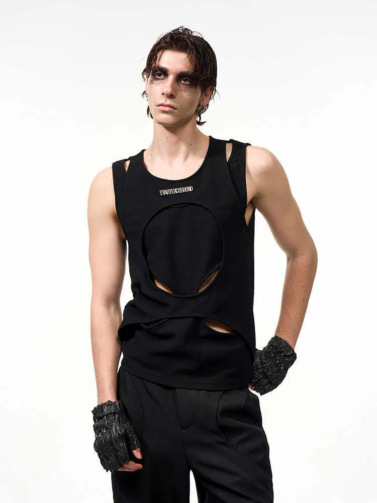 Man wearing a black sleeveless waistcoat with hollow white thread detail and a round neck.