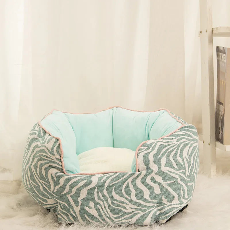 Blue octagonal pet bed with high sides, soft interior, and a removable mat for a cat or small dog.