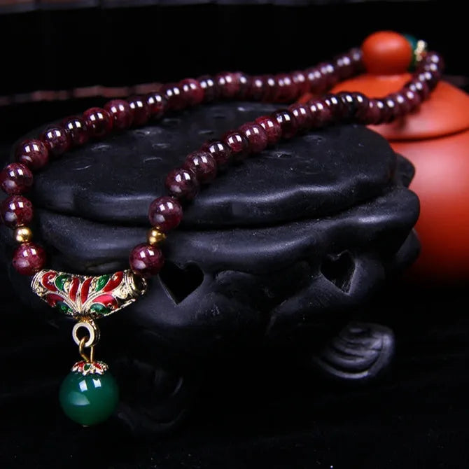 Natural garnet women's bracelet with golden toad charm and 7mm beads