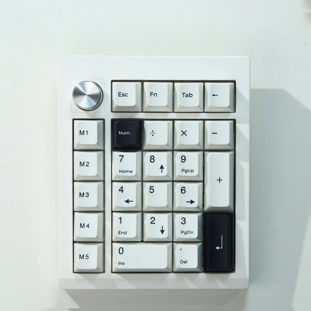 Black and white wireless mechanical Bluetooth numeric keypad with three connection modes.