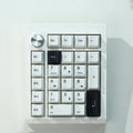 Black and white wireless mechanical Bluetooth numeric keypad with three connection modes.