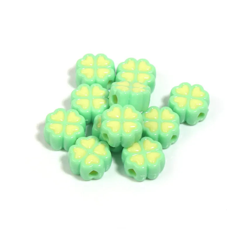15mm acrylic clover-shaped beads with love pattern in multiple pastel colours including rose red, pink, yellow, green, blue, and purple