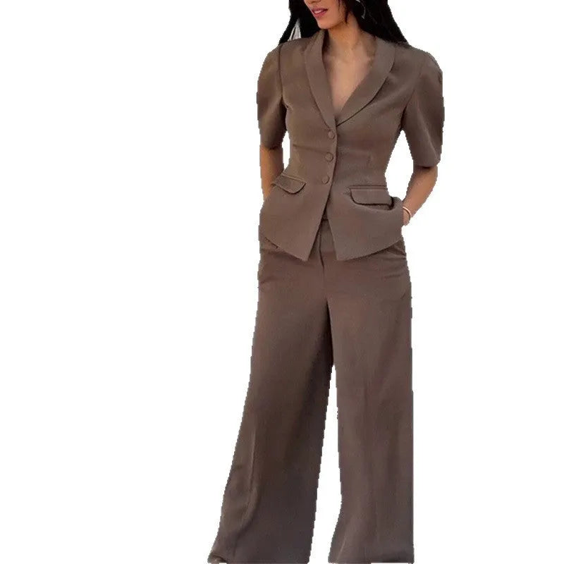 Brown men's slim fit two-piece suit with long sleeve top and trousers on a hanger.
