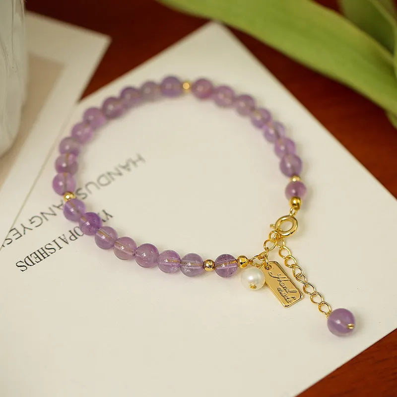 Women's natural crystal amethyst bracelet in romantic lavender colour with zodiac modelling design