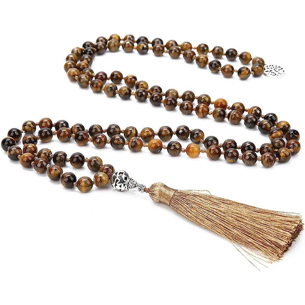 Handmade knotted beaded necklace with geometric stone pendant in natural colours.