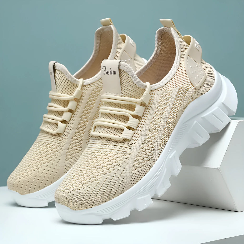 Women's white Flyknit sneakers with thick PVC sole and lace-up front