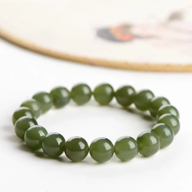 Polished Hetian jade ball bracelet showing spherical beads on a string.