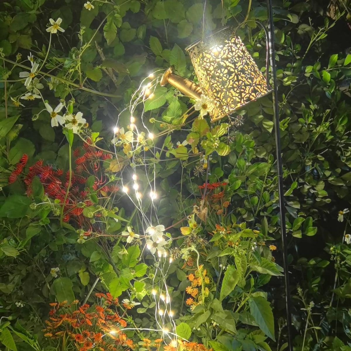 Solar butterfly kettle garden light with wrought iron construction and decorative design