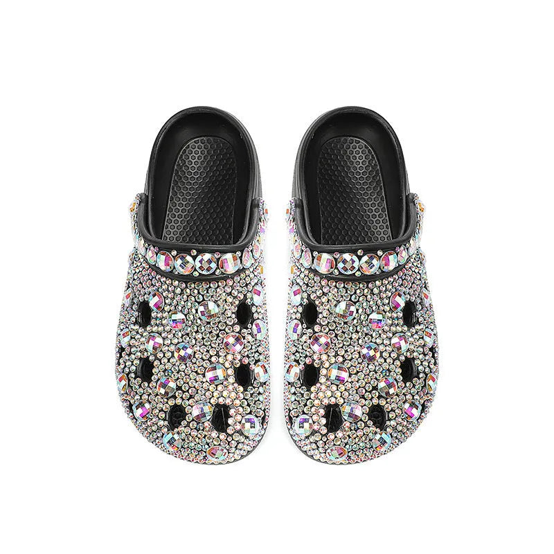 Black women's platform sandals with rhinestone details on an EVA upper and sole.
