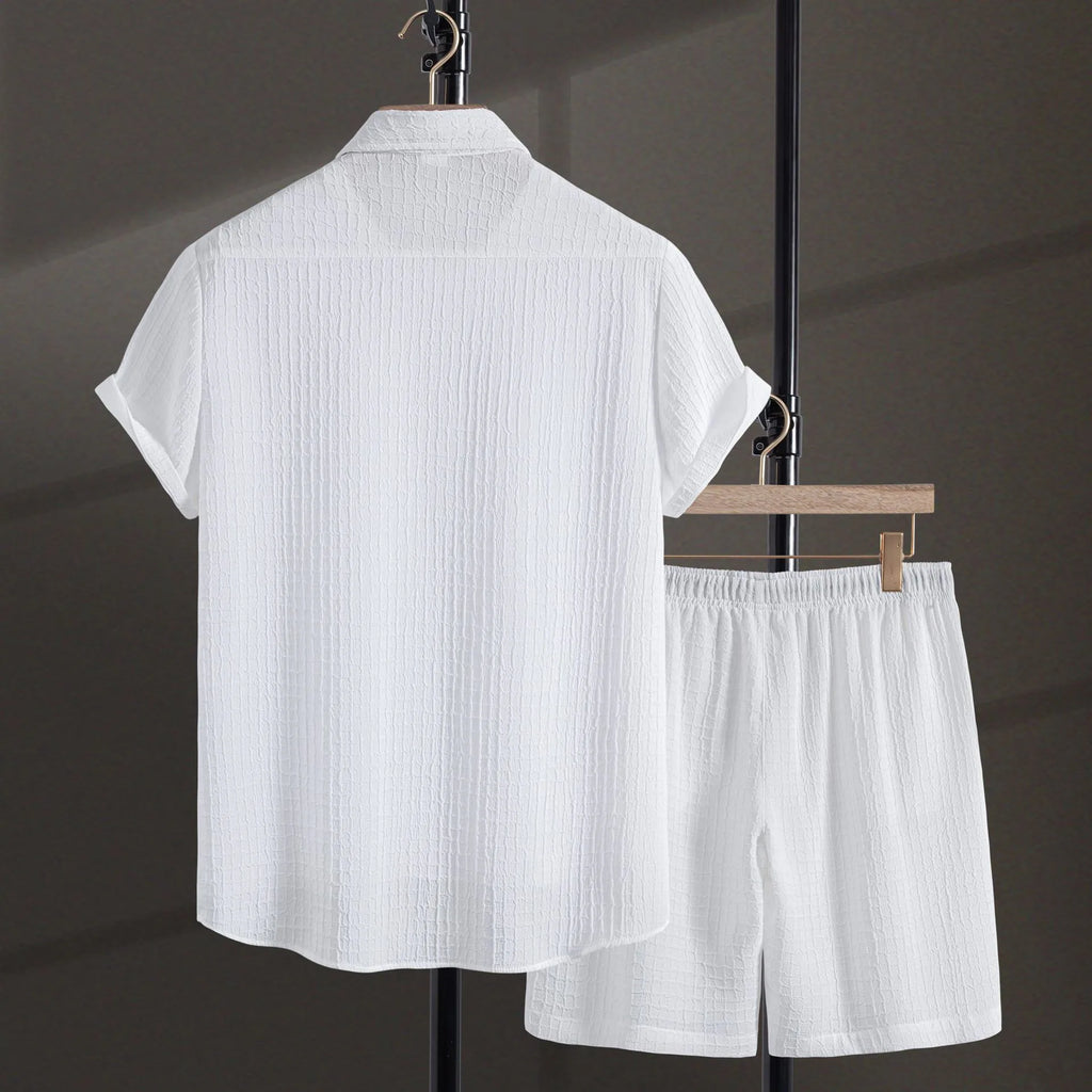 Man wearing a white cotton blend jacquard short sleeve shirt and matching shorts from a casual suit set.