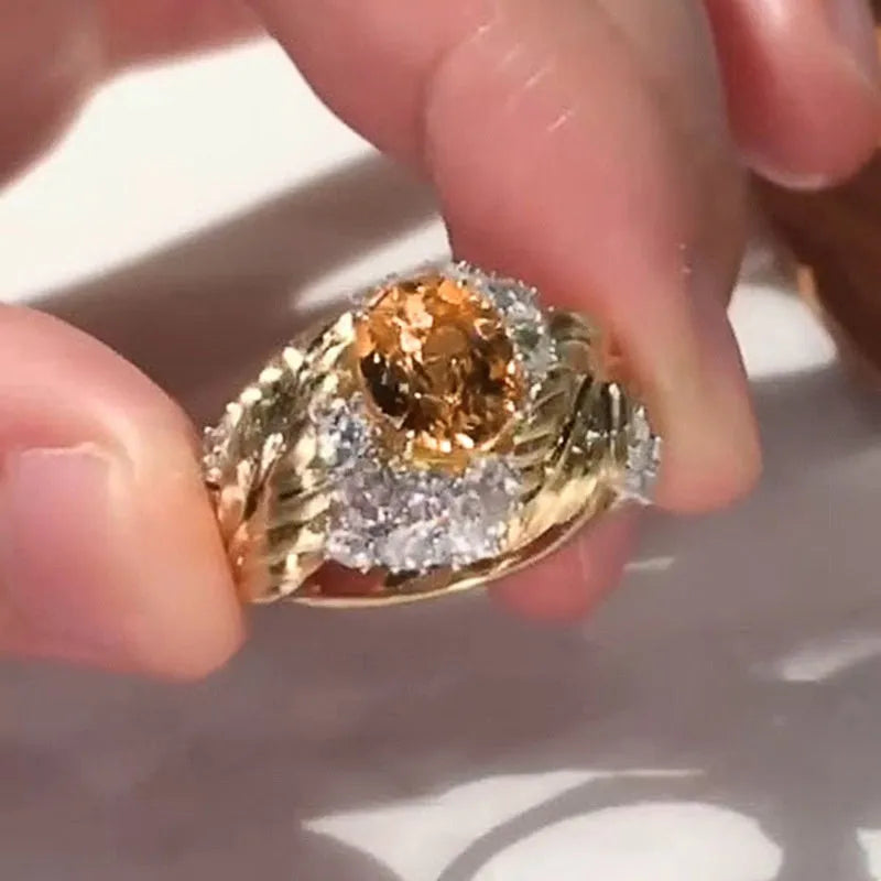 Gold colour copper feather ring with geometric embossing and yellow zircon stone centre