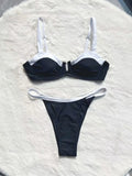 Women's low waist black bikini swimsuit with stitching split detail.