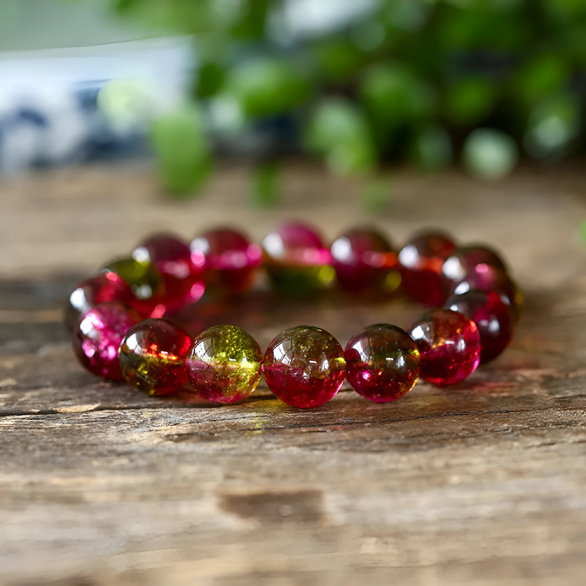 Women's handmade watermelon crystal bracelet on wrist, showing pastoral style and available bead sizes.