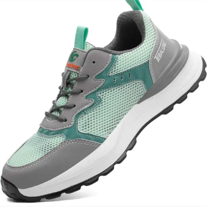 Green men's low-top safety work shoes with mesh panels and a plastic toe cap on a white background.