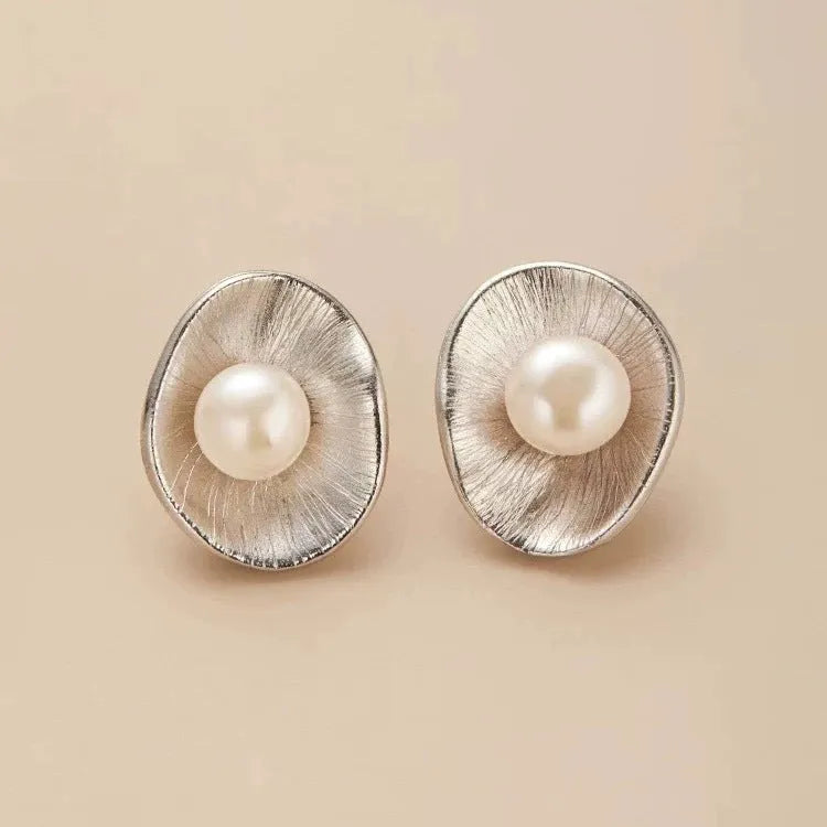 Gold coloured geometric pearl sterling silver needle ear studs for women.