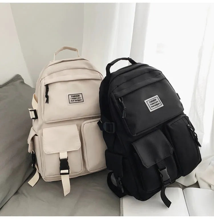 Black and white nylon student backpack with laptop compartment and external pockets
