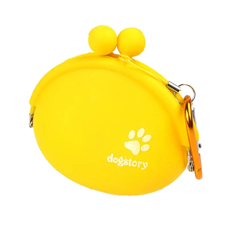 Blue silicone dog treat pouch with hook and loop closure, shown attached to a waistband.