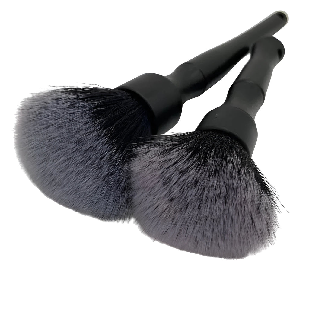 Black car detailing brush with super soft pig hair bristles shown in two size options for interior cleaning