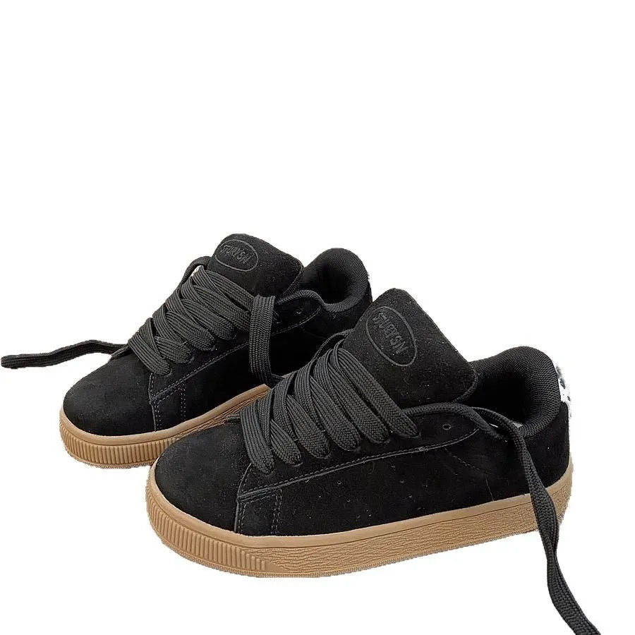 Black retro low-top sneakers with lace-up front, round toe, and waterproof platform sole