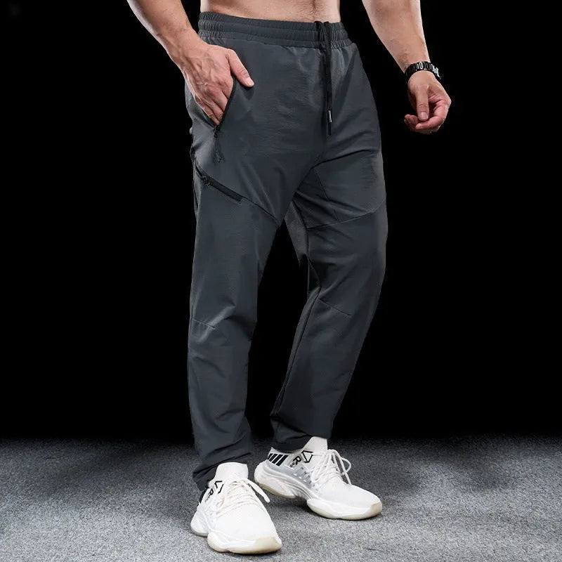 Men's waterproof quick-drying exercise trousers in nylon fabric for sports and fitness