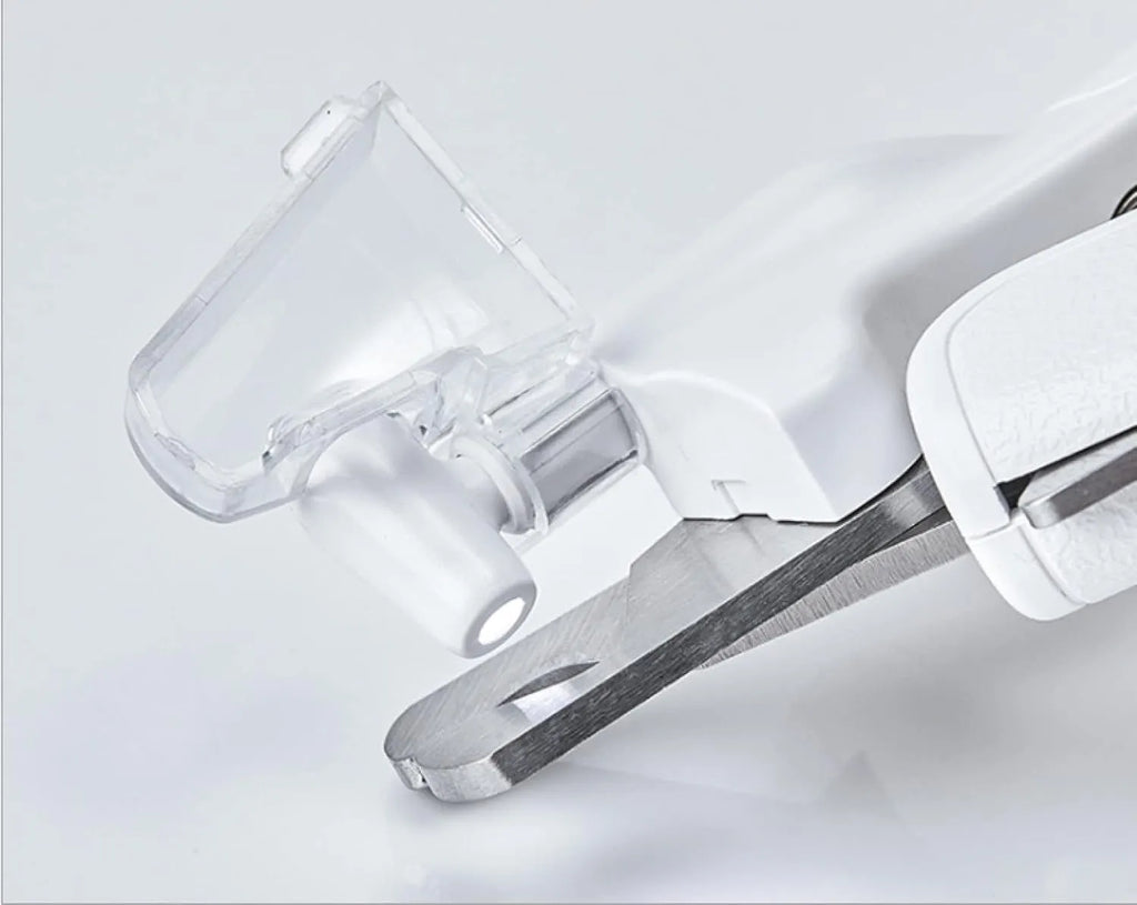 White LED pet nail clippers with transparent anti-splash guard open to show triangular stainless steel blades