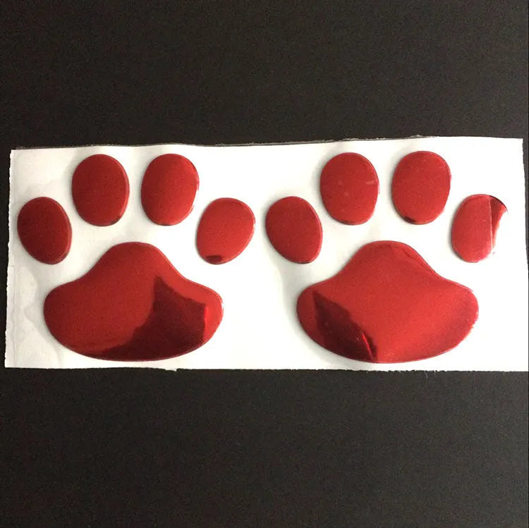 PVC car sticker with 3D hand-shaped brush texture forming dog footprints, in black, gold, red, or silver.