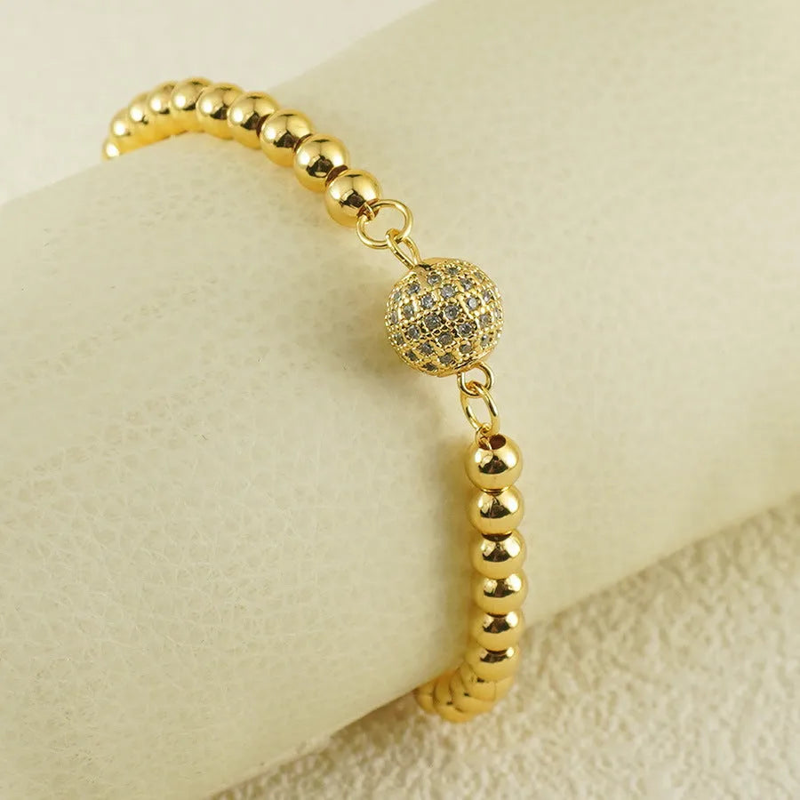 Women's copper bracelet with heart-shaped Arabic design and zircon stone detailing