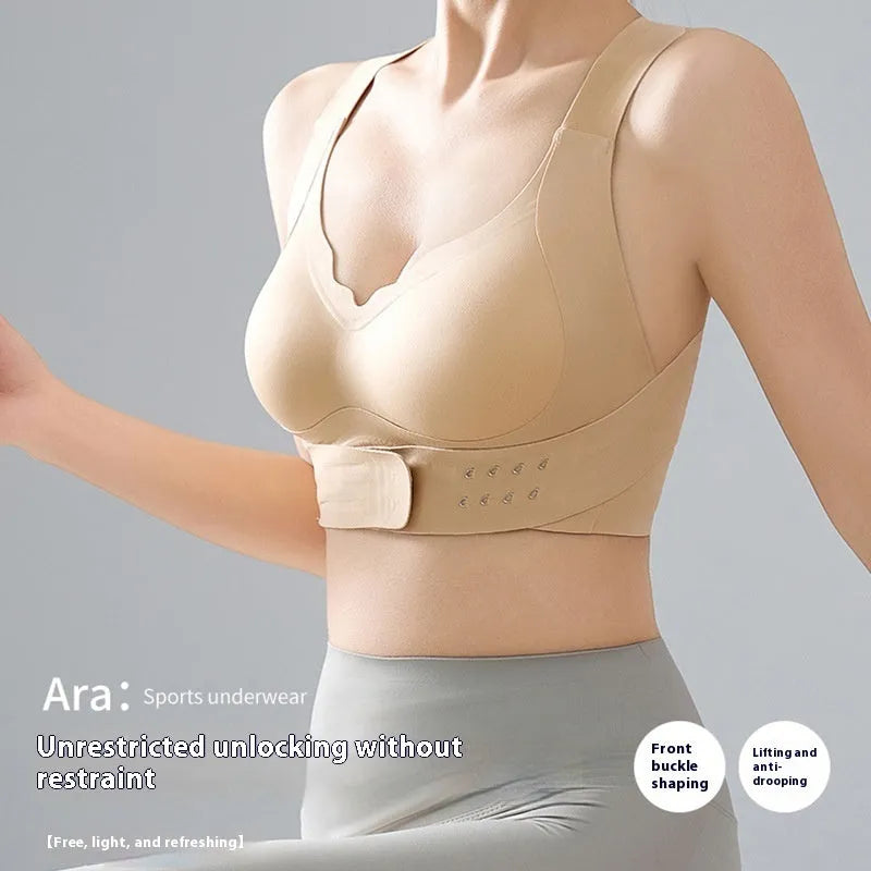 Women's black cross back yoga bra with front buckle closure on a mannequin.