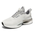 Men's low-top running shoes in beige with a rotating buckle and mesh upper, shown on a white background.
