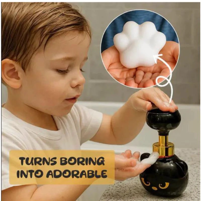 Black cartoon cat shaped manual foam soap dispenser on countertop