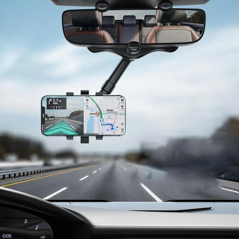 Black rearview mirror car phone holder with telescopic arm and four-claw phone grip, shown in a vehicle.