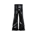 Black shiny patent leather skinny jeans with mid waist and straight leg on a model