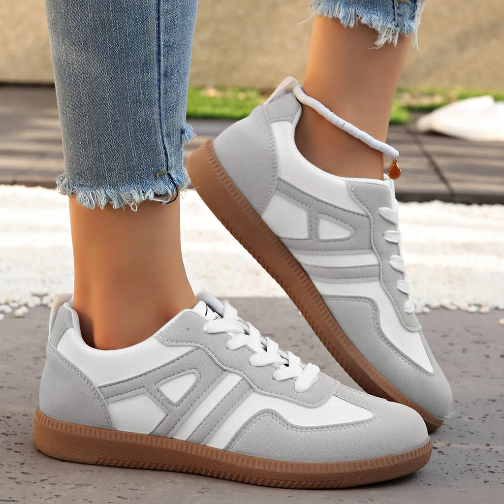 Women's retro lace-up jogging shoes in black, grey, and khaki colours showing round toe and platform heel.