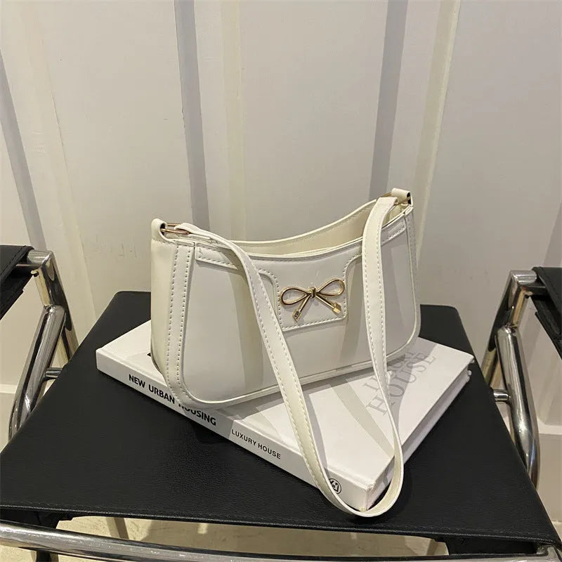 Square PU leather shoulder bag with a single strap and bow decoration in a choice of six colours