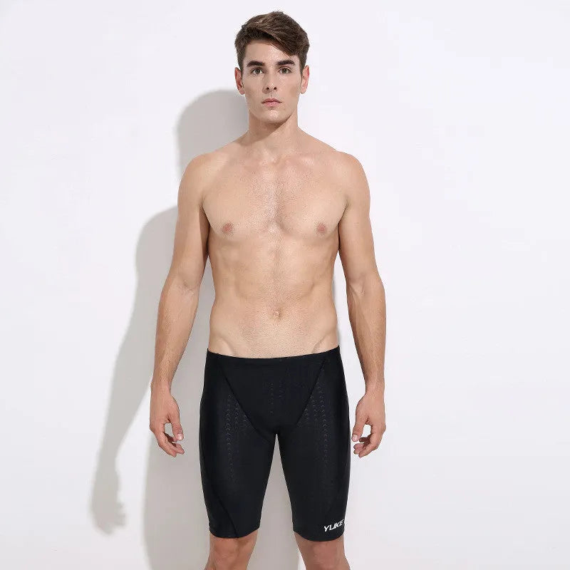 Men's black swimming set with polyester trunks, anti-fog goggles, waterproof cap, accessories and carrying bag