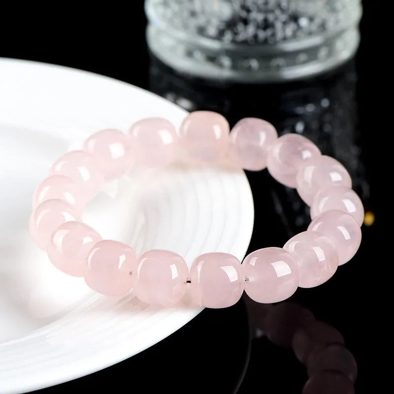 Pink natural crystal bamboo barrel bead bracelet with geometric 11-12mm beads.